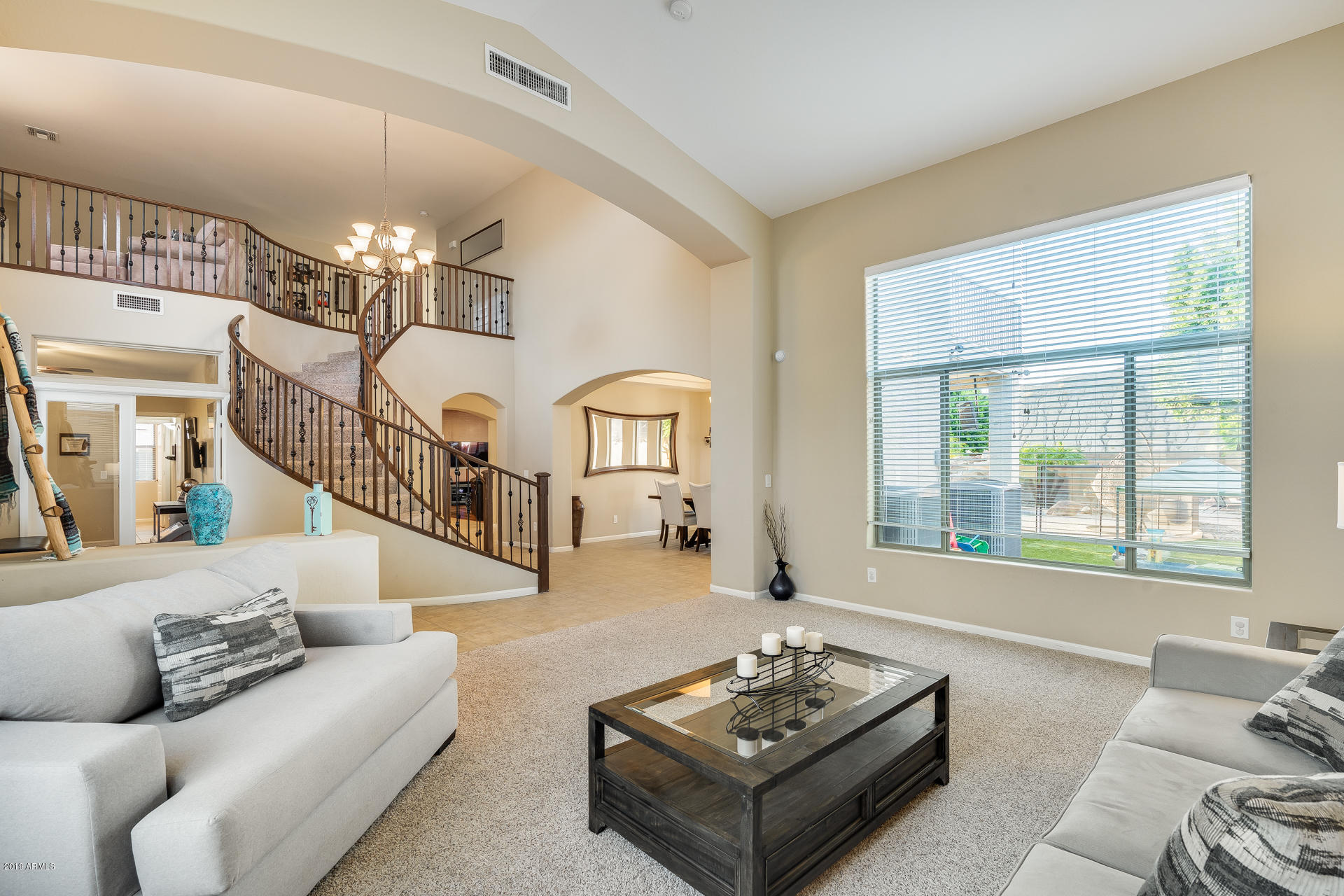 2028 West Caleb Road Phoenix, AZ 85085 - Photo 11 of 57 a living room with furniture and a large window