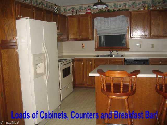 5322 Finch Farm Road Trinity, NC 27370 - Photo 3 of 8 Other. Spacious kitchen with lots of cabinets, counter space and a wonderful breakfast bar.