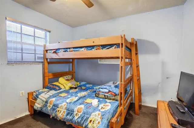 a bedroom with a bed and tv