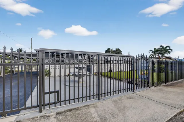 a picture of a room with a white wall and white cabinet