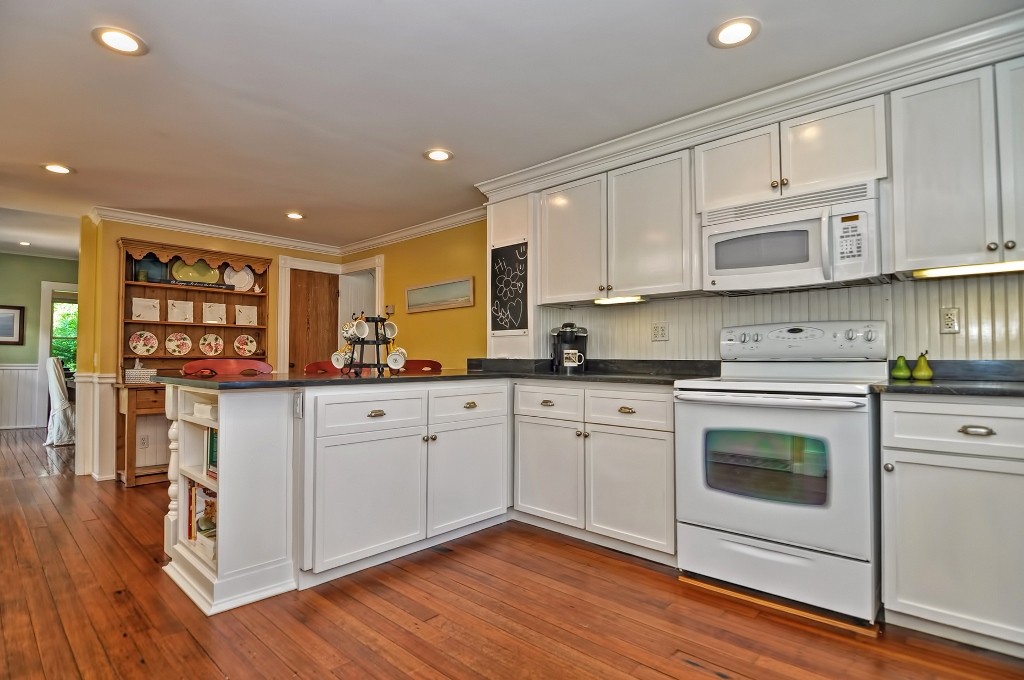 73 Frankland Road Ashland, MA 01721 - Photo 17 of 30 a kitchen with stainless steel appliances granite countertop a stove a sink and a refrigerator