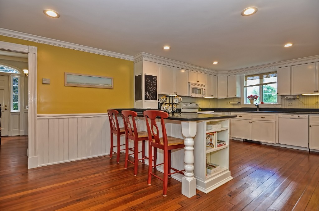 73 Frankland Road Ashland, MA 01721 - Photo 18 of 30 a kitchen with stainless steel appliances granite countertop a stove top oven a sink a refrigerator with white cabinets and wooden floor