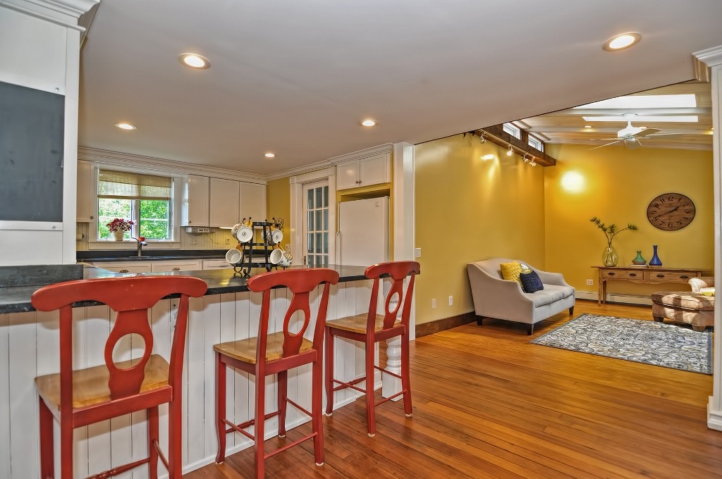 73 Frankland Road Ashland, MA 01721 - Photo 19 of 30 a living room with furniture a rug and kitchen view