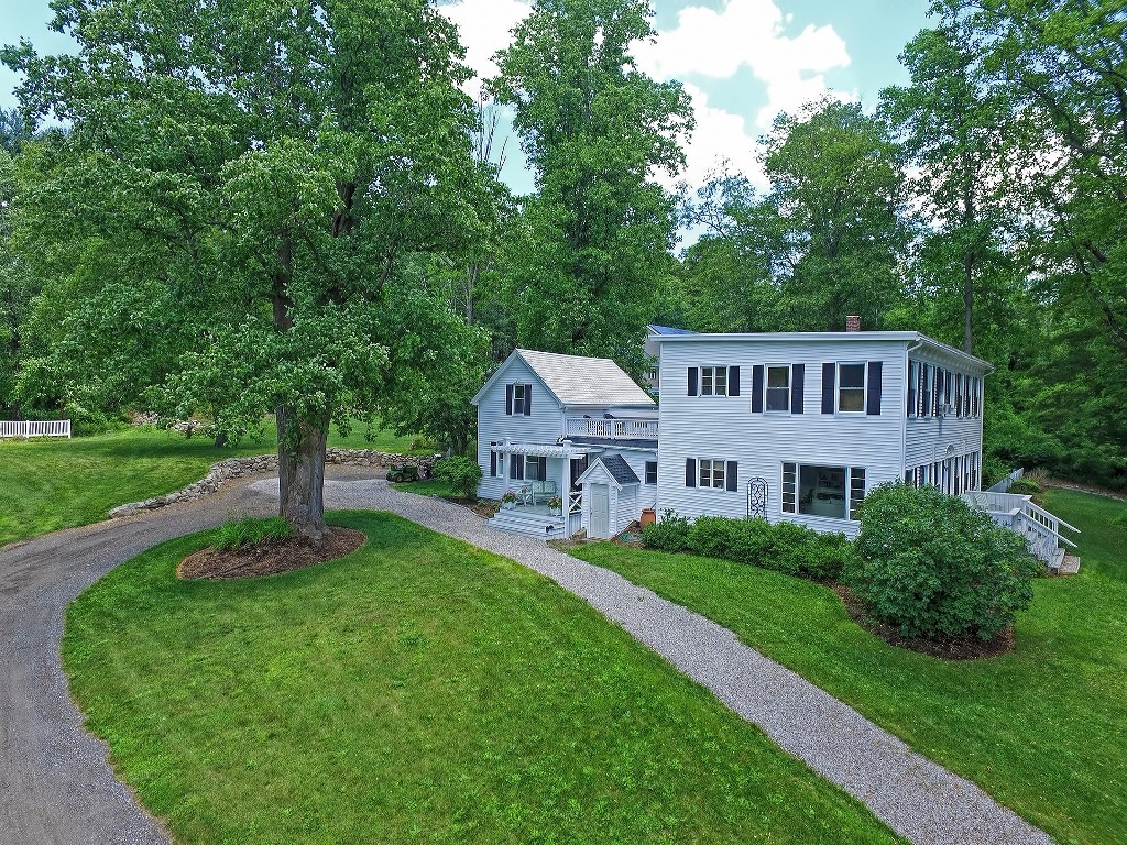 73 Frankland Road Ashland, MA 01721 - Photo 2 of 30 a view of a house with a yard deck and a small cabin