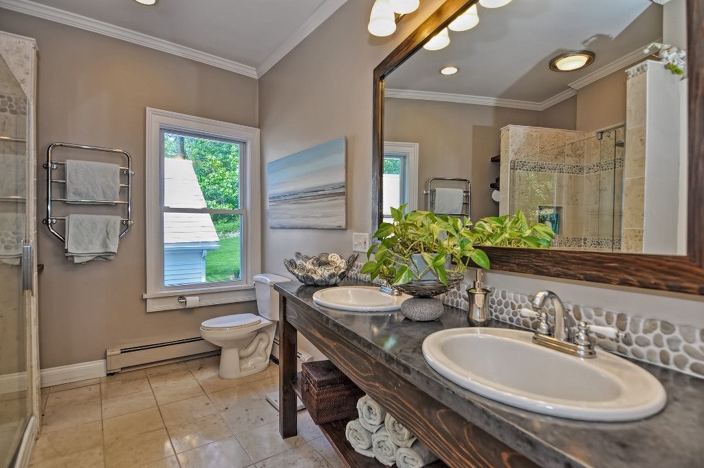 73 Frankland Road Ashland, MA 01721 - Photo 26 of 30 a bathroom with a granite countertop sink and a mirror with window