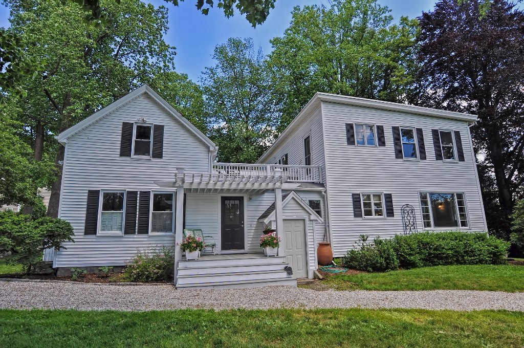 73 Frankland Road Ashland, MA 01721 - Photo 6 of 30 a front view of a house with a yard