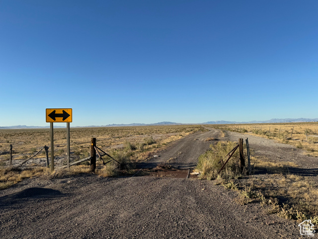 6000 North 10000th West Delta, UT 84624 - Photo 16 of 20 View of dirt / gravel road featuring a view of countryside and a mountain view