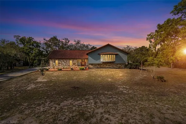 a view of a backyard with a patio
