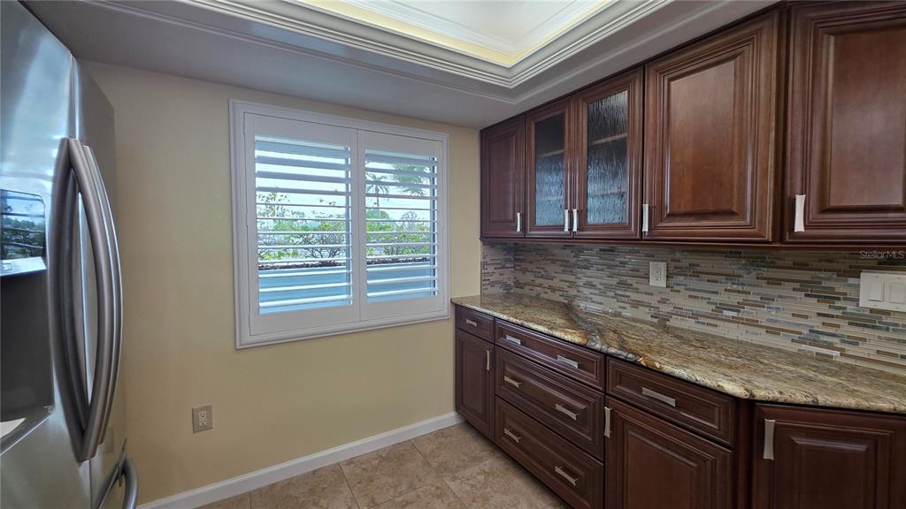 9604 Cortez Road West, Unit 213 Bradenton, FL 34210 - Photo 13 of 36 a view of kitchen with granite countertop cabinets appliances and a window