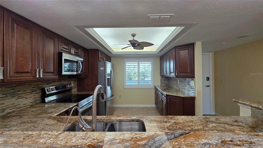 9604 Cortez Road West, Unit 213 Bradenton, FL 34210 - Photo 15 of 36 a view of a livingroom with furniture and a window