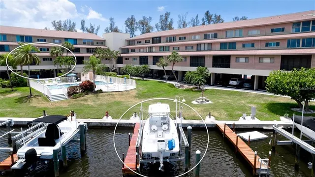 a view of swimming pool with outdoor seating and city view