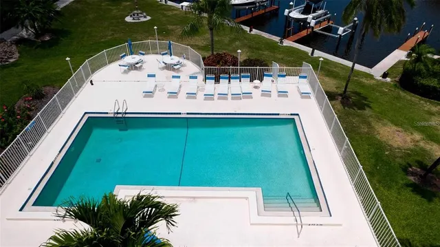 a view of a swimming pool with a patio