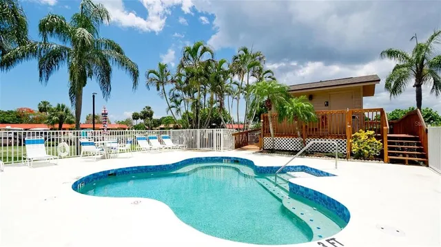a view of a swimming pool with a bench