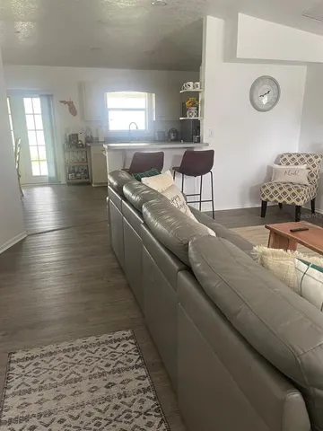 a living room with furniture and a rug