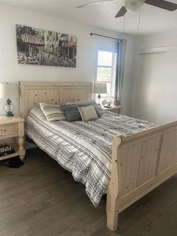 a bedroom with bed and window