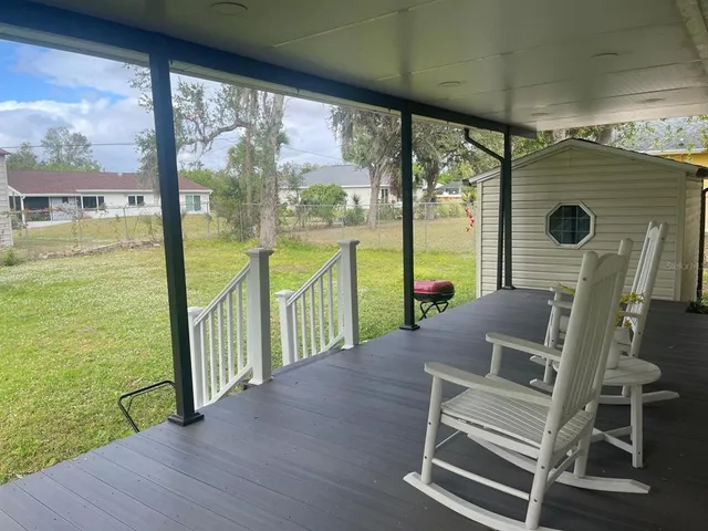 a view of a balcony with lake view and a ocean view