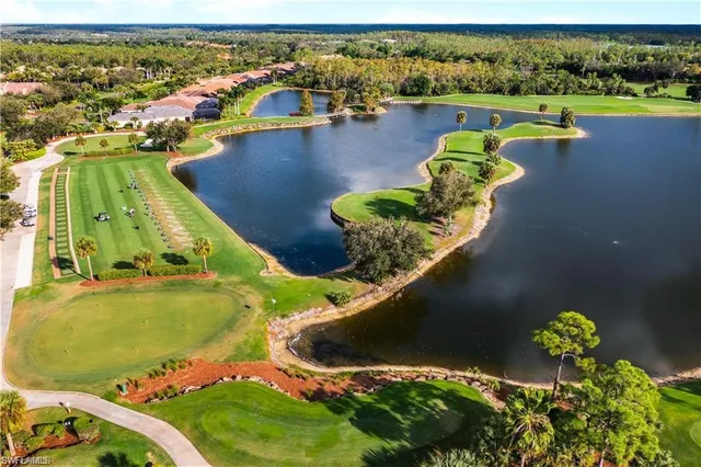 an aerial view of a house with a lake view
