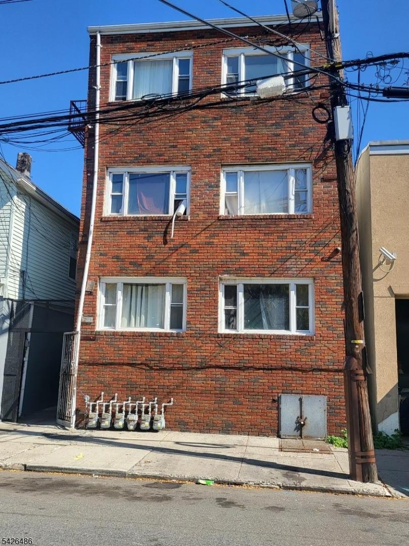 111 Pine Street Elizabeth Port, NJ 07206 - Photo 1 of 9 a front view of a house