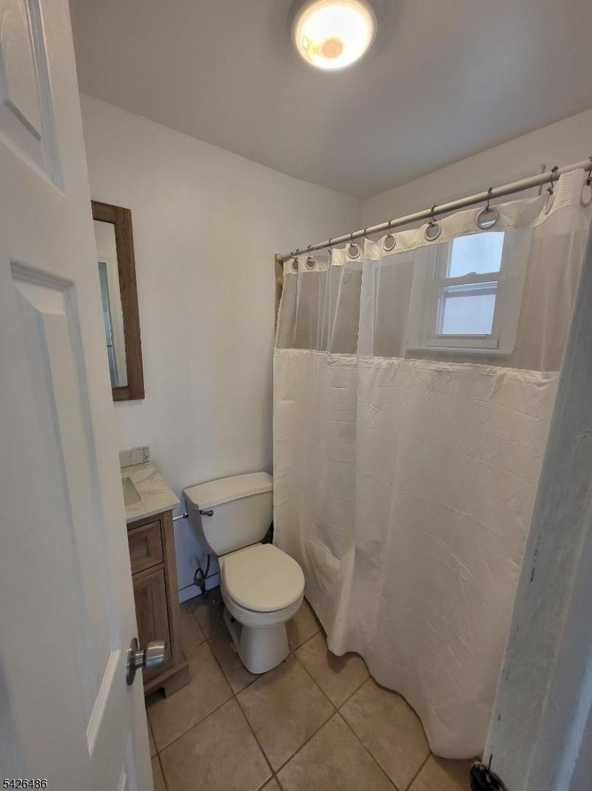 111 Pine Street Elizabeth Port, NJ 07206 - Photo 9 of 9 a bathroom with a toilet and a shower