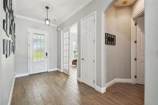 a kitchen with stainless steel appliances granite countertop a sink and a white cabinets