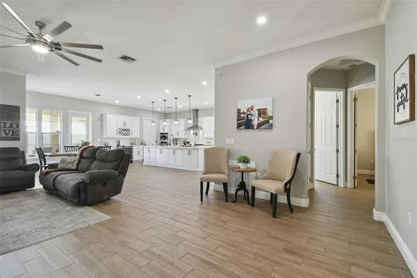 a kitchen with stainless steel appliances a sink stove and cabinets