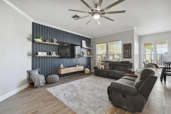 a kitchen with stainless steel appliances kitchen island granite countertop a stove a sink and a refrigerator