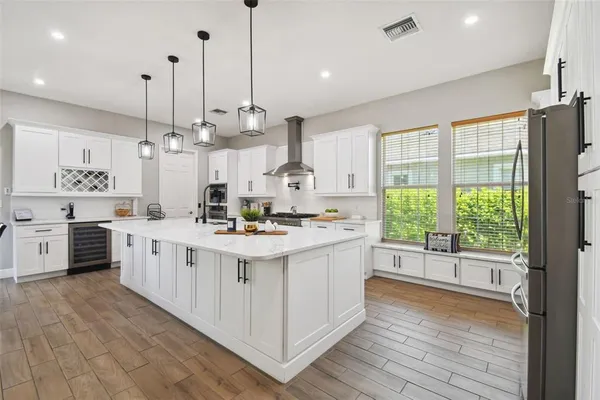 a bathroom with a double vanity sink mirror and toilet