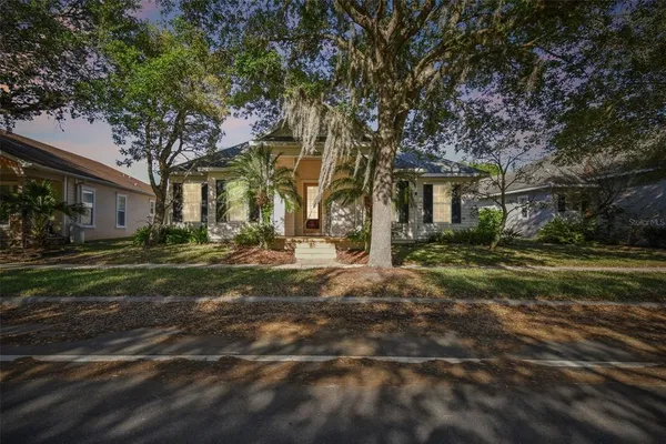 a dining room with furniture and a window