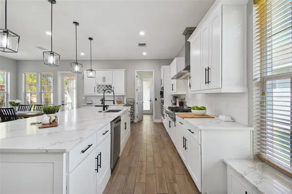 a bedroom with a large bed and a large window