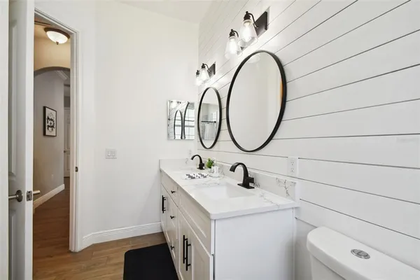 a front view of a house with outdoor seating