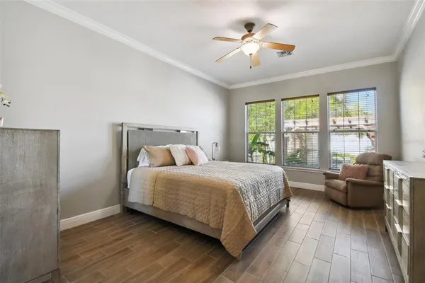 a backyard of a house with barbeque oven and outdoor seating