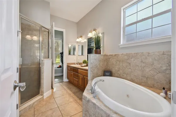 an aerial view of residential houses with outdoor space and lake view