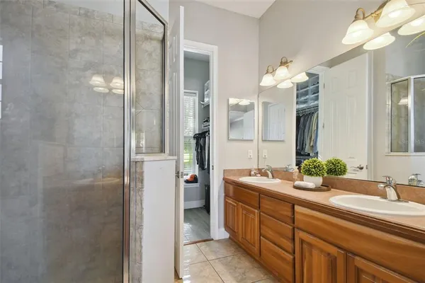 an aerial view of residential houses with outdoor space and ocean view
