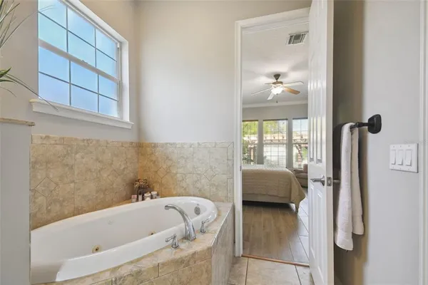 an aerial view of residential houses with outdoor space and ocean view