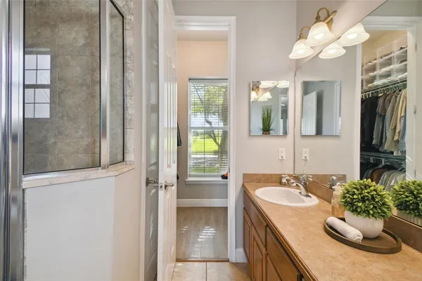 an aerial view of a house with a lake view