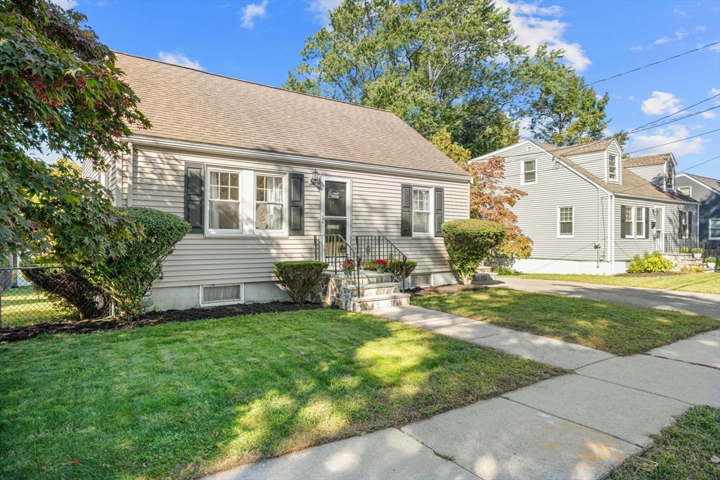 a view of a house with backyard sitting area and garden