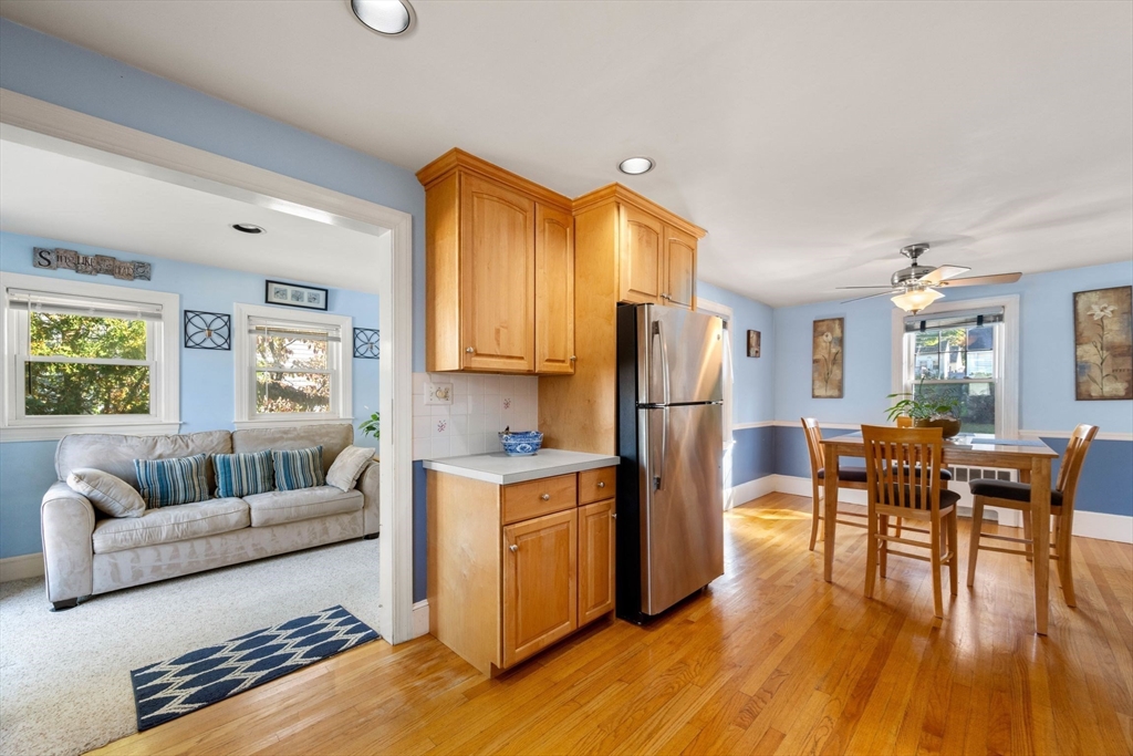 55 Badger Road Boston, MA 02136 - Photo 12 of 33 a living room with stainless steel appliances granite countertop furniture a wooden floor and a window
