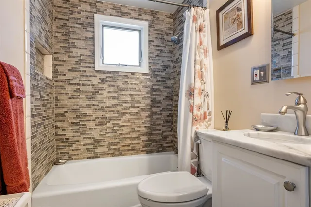 a bathroom with a sink toilet and bathtub