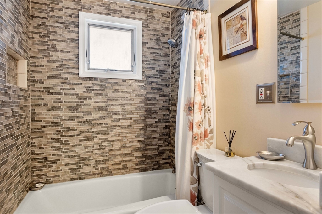 55 Badger Road Boston, MA 02136 - Photo 16 of 33 a bathroom with a sink and a mirror