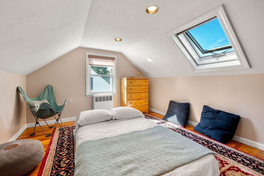 55 Badger Road Boston, MA 02136 - Photo 23 of 33 a bedroom with a bed and wooden floor