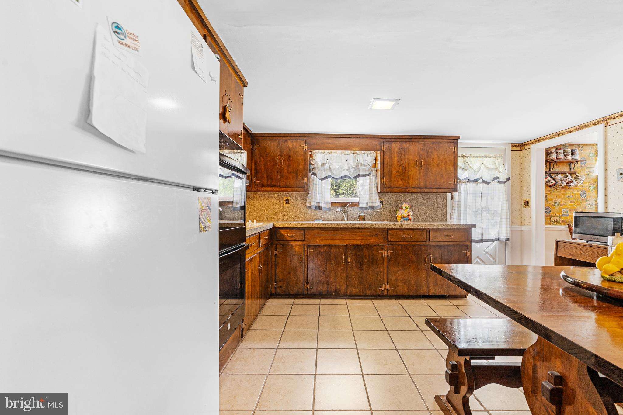 3 Snydertown Road Hopewell, NJ 08525 - Photo 13 of 25 a kitchen with stainless steel appliances kitchen island granite countertop a sink and cabinets