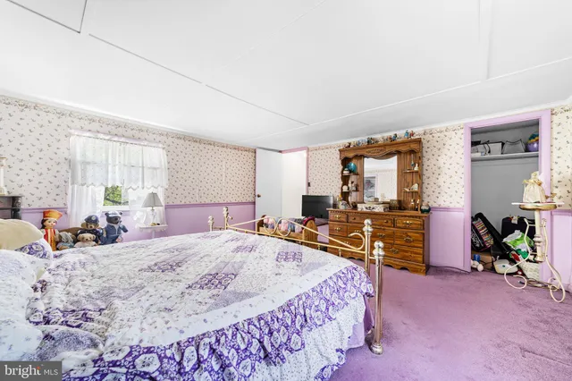 a bed room with a bed and a large mirror