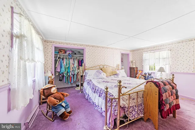 a bed room with furniture and a window