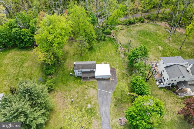 an aerial view of residential house with outdoor space