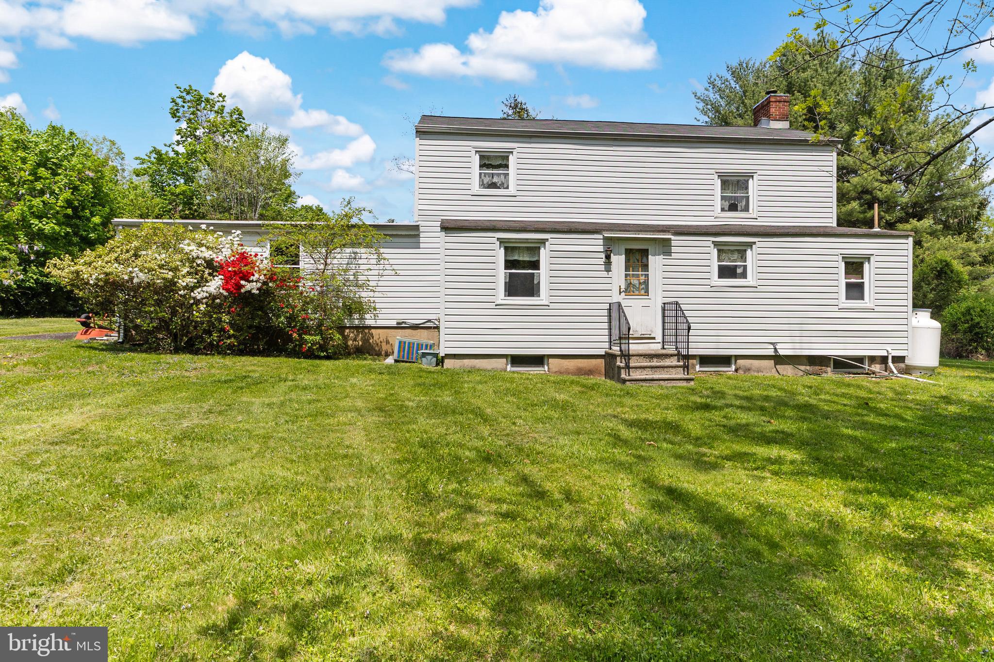3 Snydertown Road Hopewell, NJ 08525 - Photo 6 of 25 a front view of house with yard and trees in the background