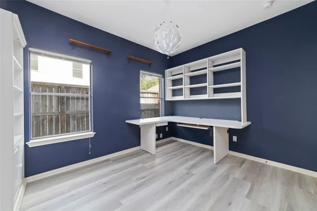 a living room with a bed and a window