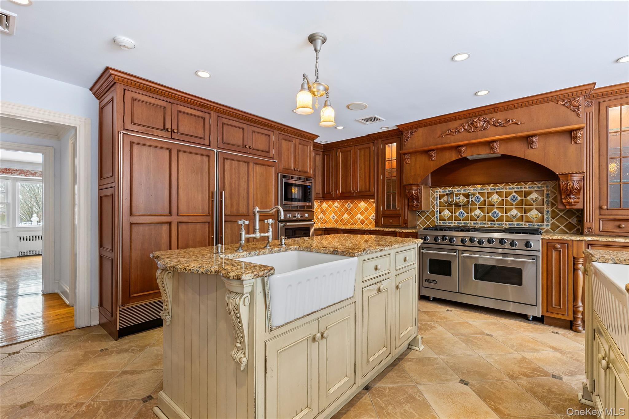 103 Pleasant Ridge Road Harrison, NY 10528 - Photo 12 of 39 a kitchen with granite countertop a stove oven and a refrigerator