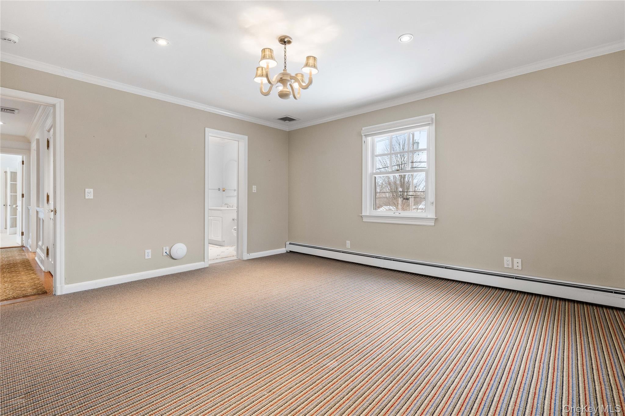 103 Pleasant Ridge Road Harrison, NY 10528 - Photo 22 of 39 an empty room with wooden floor and windows
