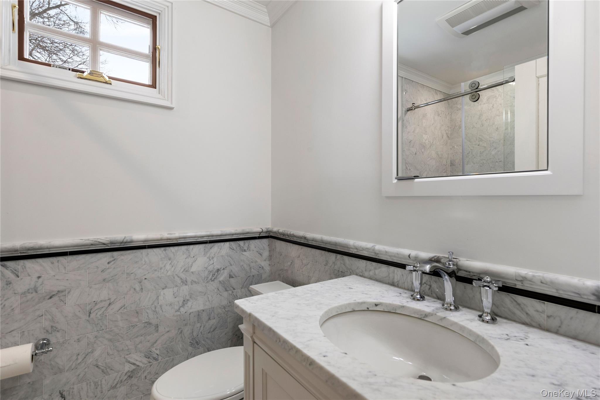 103 Pleasant Ridge Road Harrison, NY 10528 - Photo 30 of 39 a bathroom with a sink and a mirror