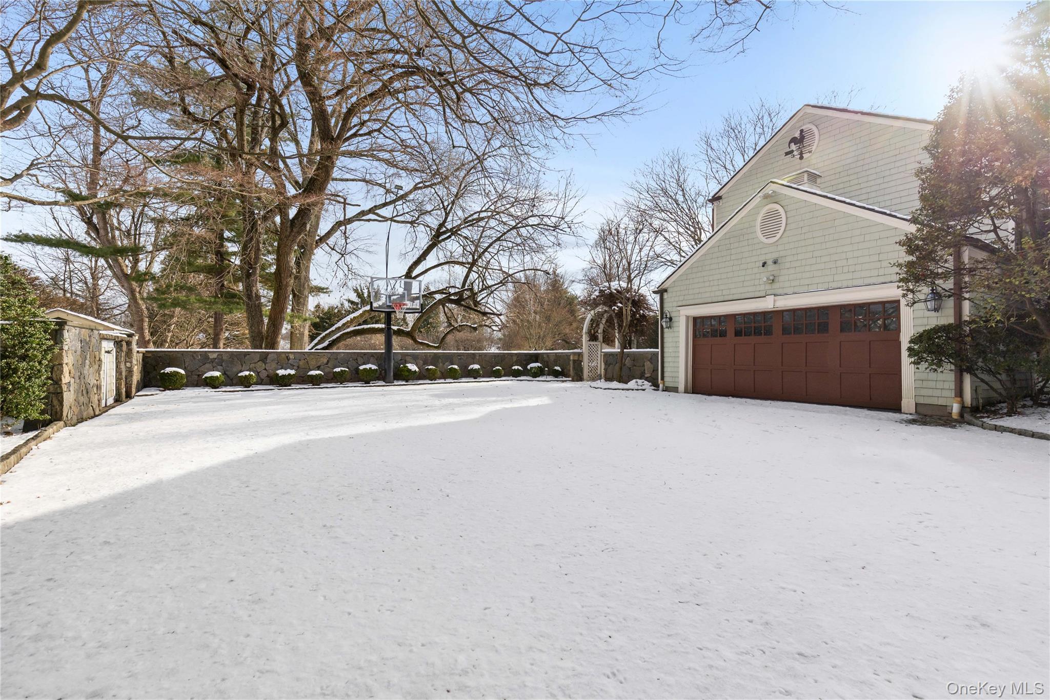 103 Pleasant Ridge Road Harrison, NY 10528 - Photo 36 of 39 a view of the house with a snow